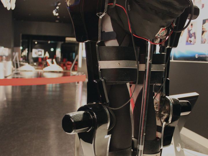 A wearable robotic leg frame with motors at the hip and knee