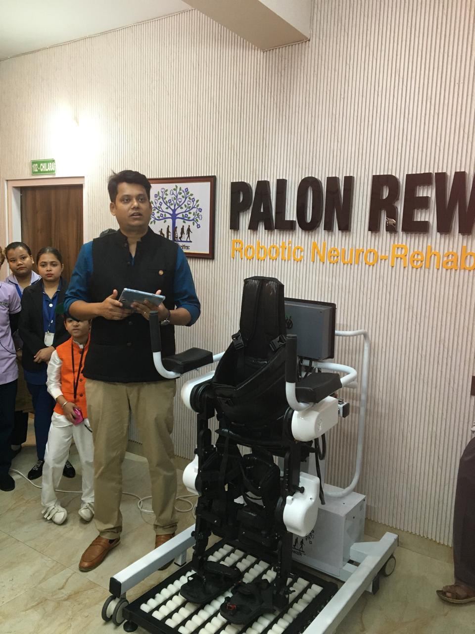 A demonstration of robotic gait training equipment at a rehabilitation center