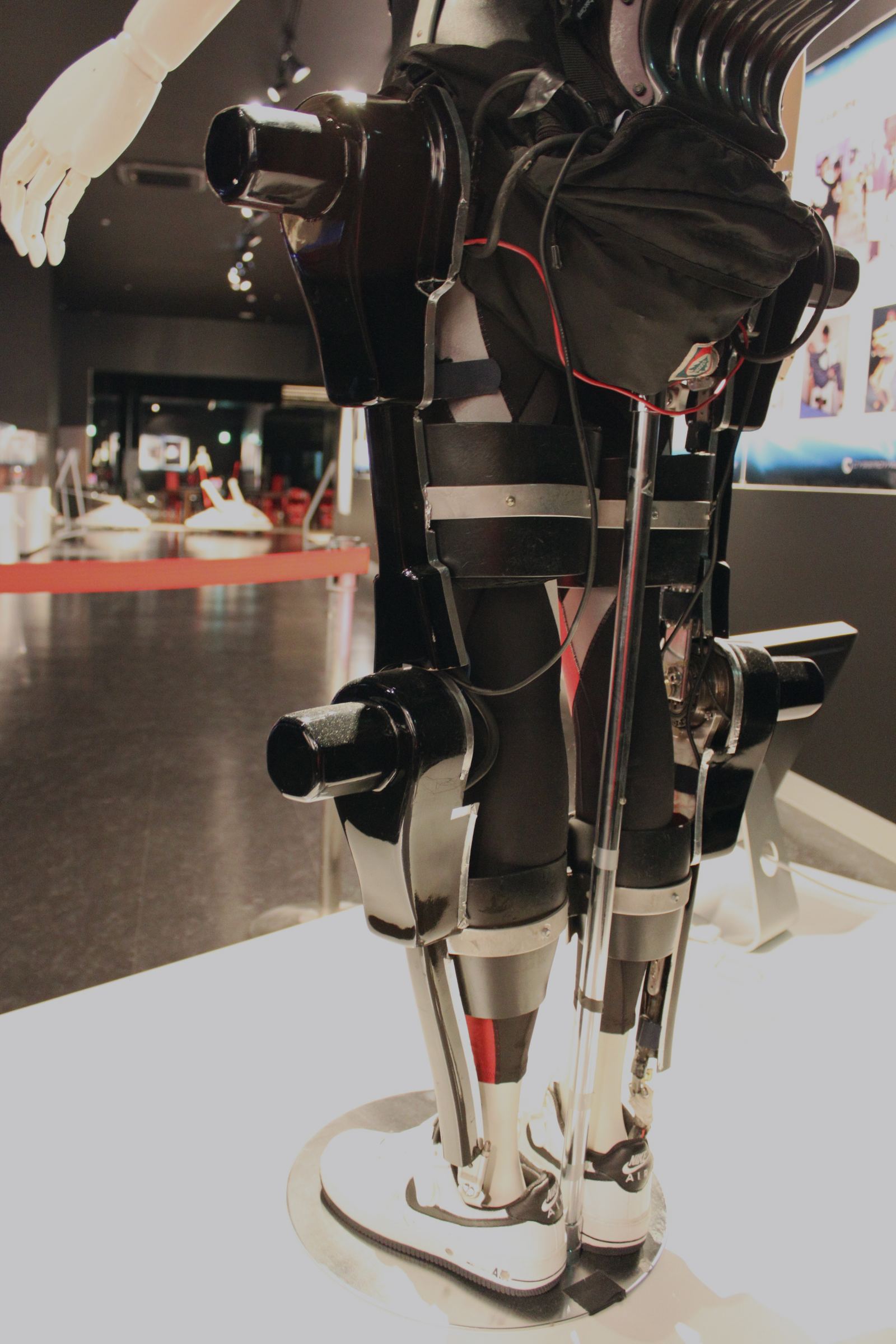 A wearable robotic leg frame with motors at the hip and knee