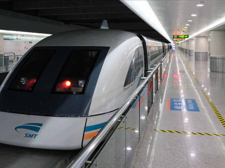 A Shanghai maglev train on its raised concrete guideway